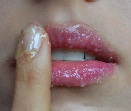 applying lip scrub