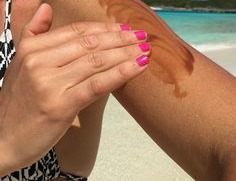 applying tanning lotion