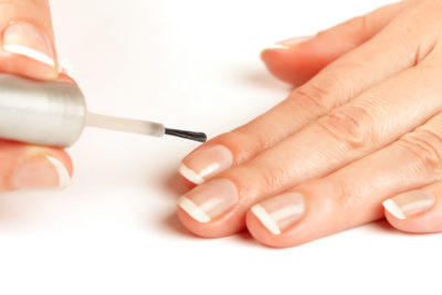 applying clear nail polish