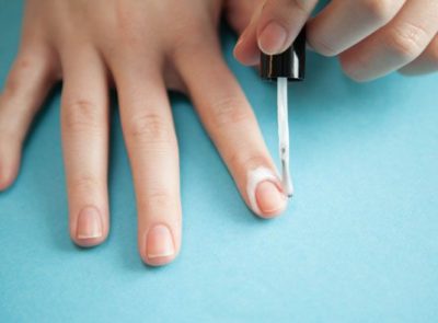 applying craft glue around nails